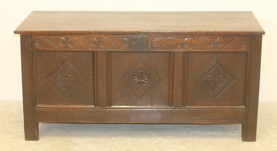 AN OAK PANELLED COFFER Image