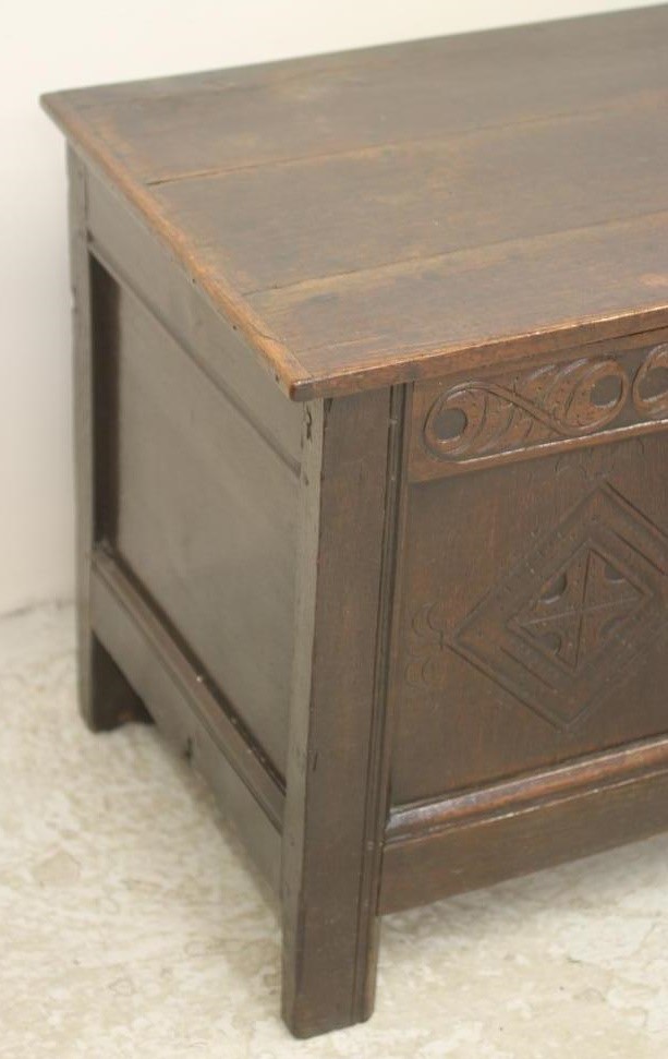 AN OAK PANELLED COFFER Image