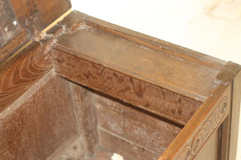 AN OAK PANELLED COFFER Image