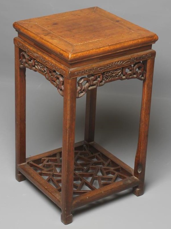 A CHINESE STAINED WOOD JARDINIERE STAND Image