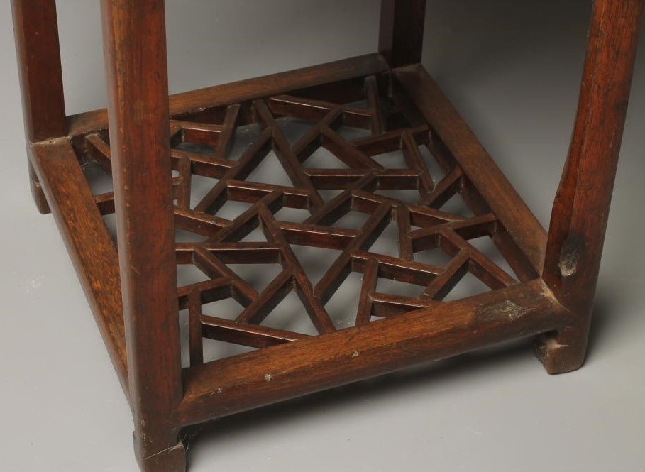 A CHINESE STAINED WOOD JARDINIERE STAND Image