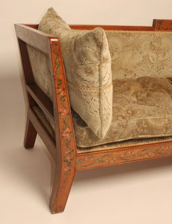 AN EDWARDIAN PAINTED SATINWOOD SETTEE upholstered in cut velvet and painted with ribbons Image