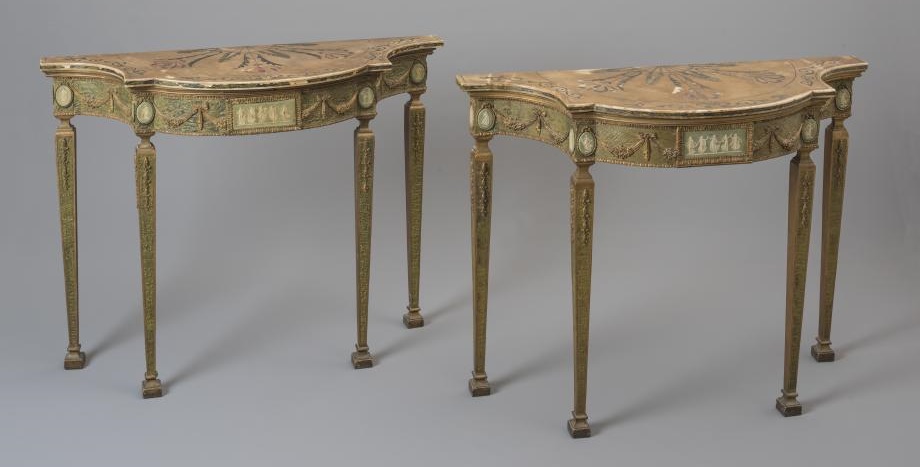 A PAIR OF PAINTED AND PARCEL GILT CONSOLE TABLES Image