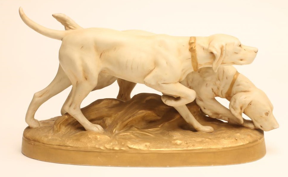 A ROYAL DUX BISQUE PORCELAIN MODEL OF A POINTER AND RETRIEVER Image