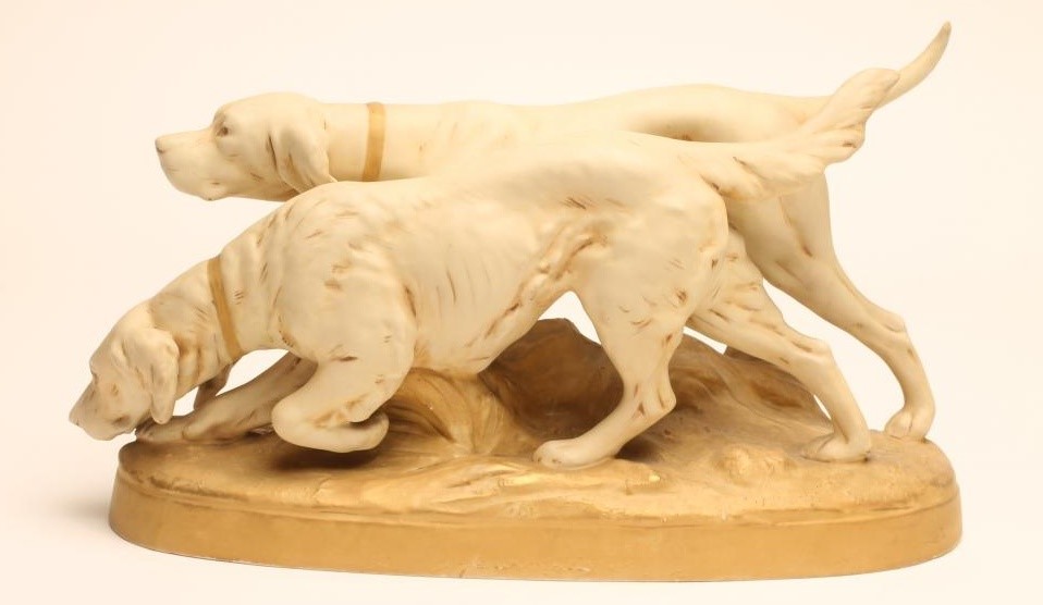 A ROYAL DUX BISQUE PORCELAIN MODEL OF A POINTER AND RETRIEVER Image