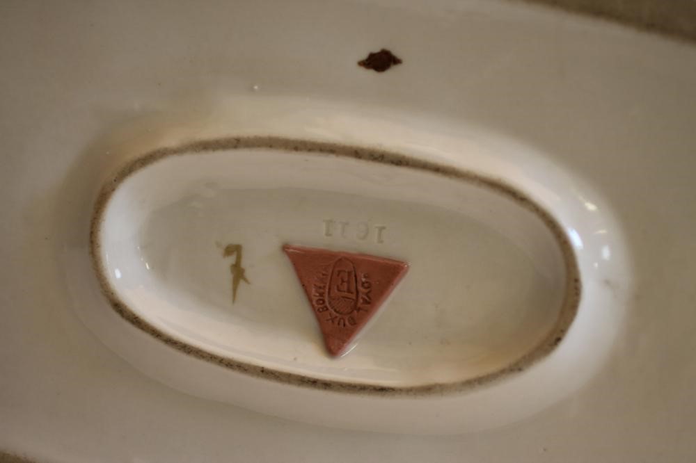 A ROYAL DUX BISQUE PORCELAIN MODEL OF A POINTER AND RETRIEVER Image