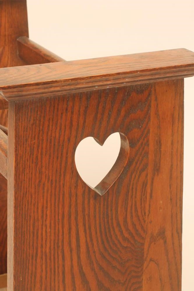 AN ARTS AND CRAFTS OAK STICK STAND of oblong form with dished dividers and lift out tray Image