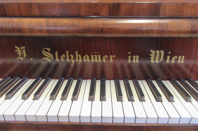 A BOUDOIR GRAND PIANO by Rufolf Stelzhamer in walnut case with stringing Image
