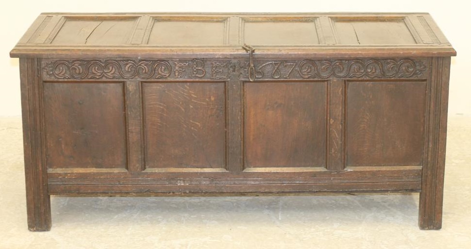 AN OAK PANELLED COFFER Image