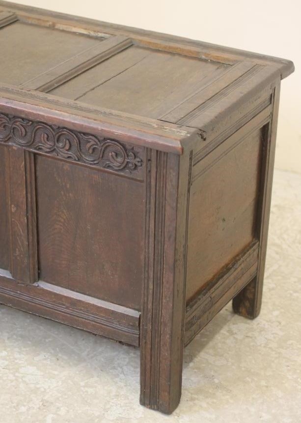 AN OAK PANELLED COFFER Image