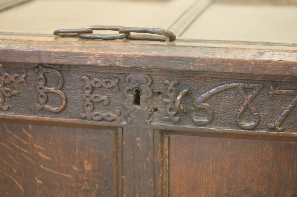 AN OAK PANELLED COFFER Image