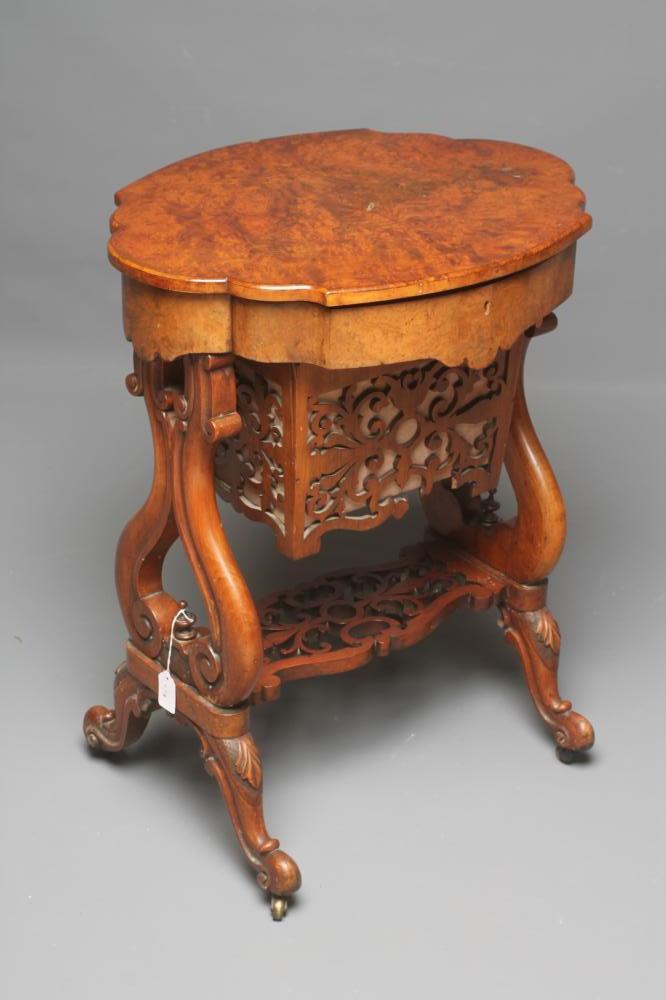 A VICTORIAN BURR WALNUT WORK TABLE of shaped oval form Image