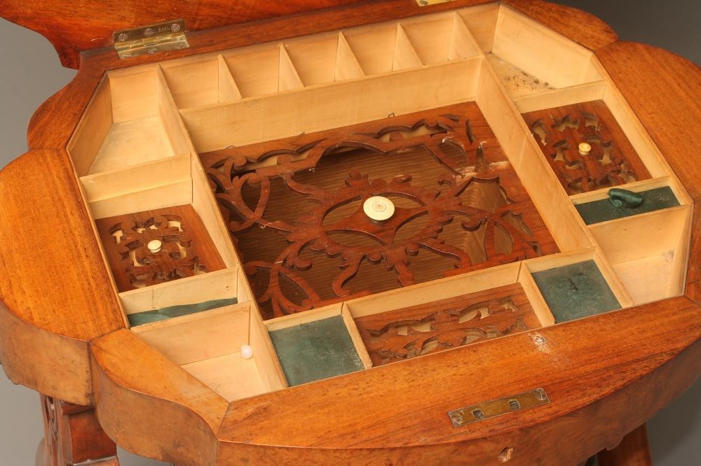 A VICTORIAN BURR WALNUT WORK TABLE of shaped oval form Image