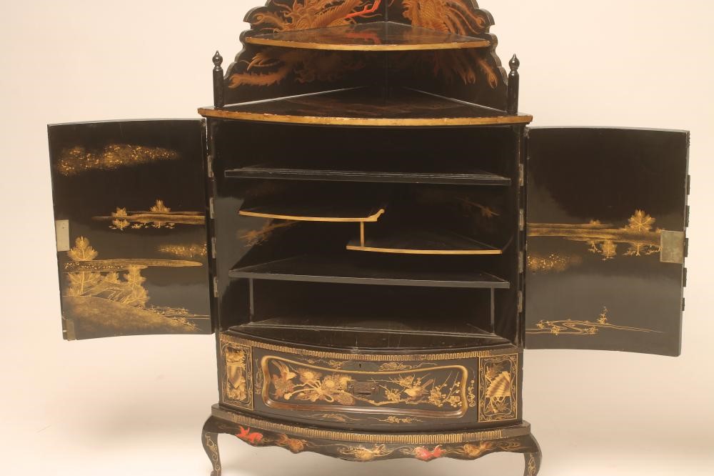 A CHINESE BLACK LACQUERED CORNER CUPBOARD Image