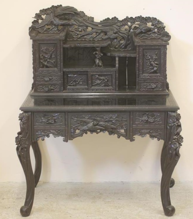 A CHINESE CARVED HARDWOOD DESK Image