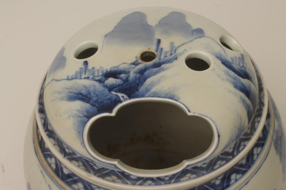 A JAPANESE PORCELAIN JAR AND COVER of cylindrical form raised upon three bracket feet Image