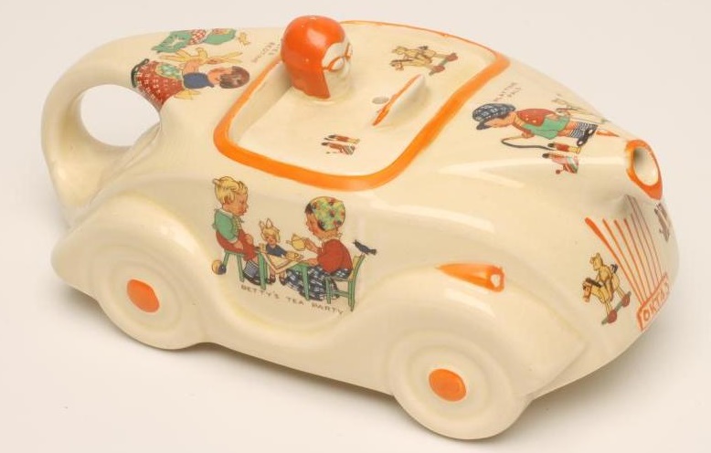 A SADLER POTTERY MABEL LUCIE ATTWELL RACING CAR NOVELTY NURSERY TEAPOT Image
