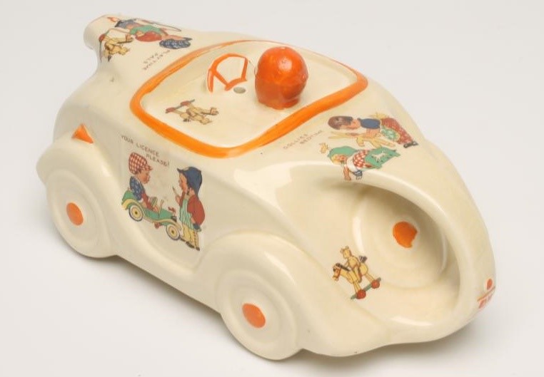 A SADLER POTTERY MABEL LUCIE ATTWELL RACING CAR NOVELTY NURSERY TEAPOT Image