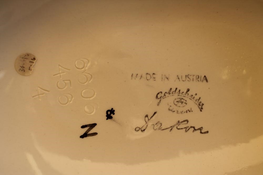 AN ART DECO DAKON GOLDSCHEIDER EARTHENWARE FIGURE of a young lady wearing a wide brimmed hat Image