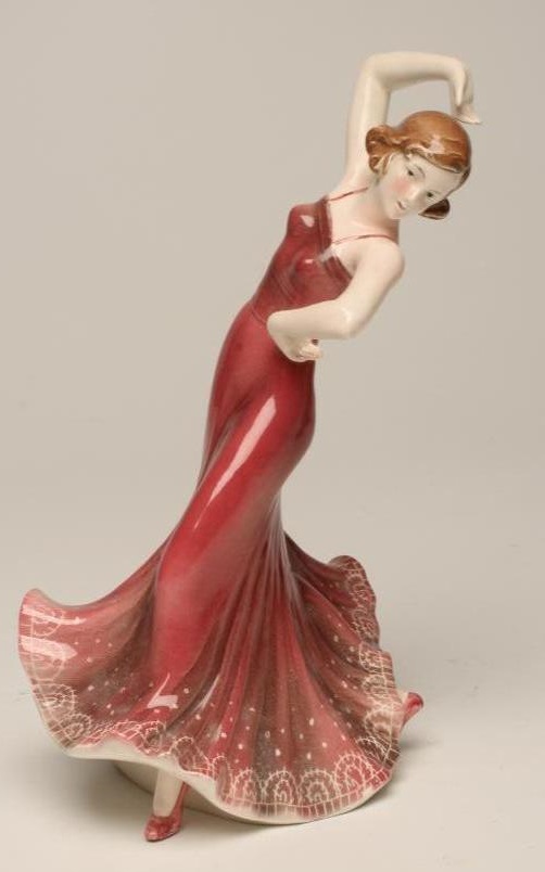 AN ART DECO KATZHUTTE EARTHENWARE FIGURE of a young lady dancer wearing a shaded dusky pink Image