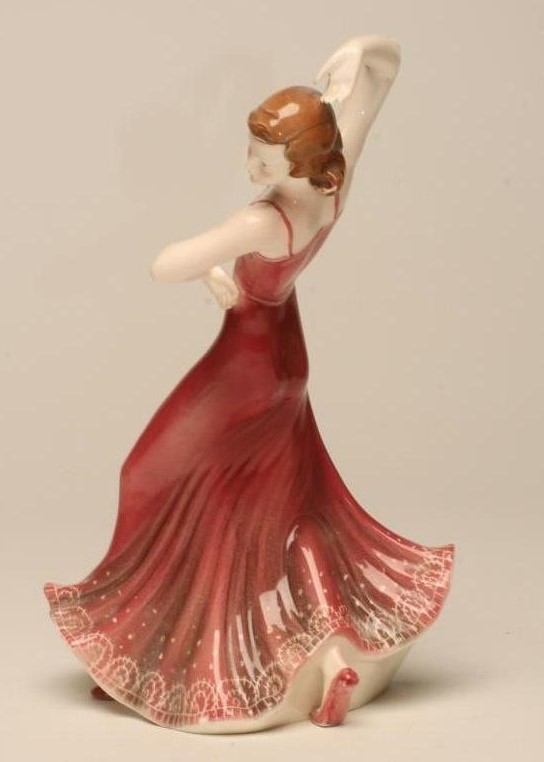 AN ART DECO KATZHUTTE EARTHENWARE FIGURE of a young lady dancer wearing a shaded dusky pink Image