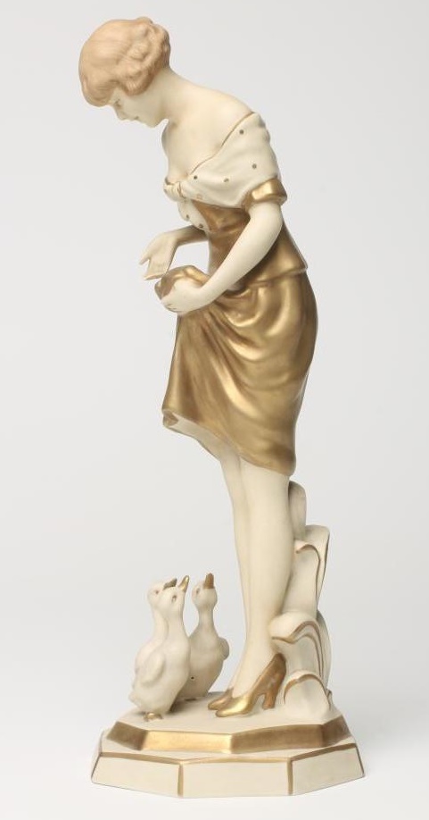 AN ART DECO ROYAL DUX BISQUE PORCELAIN FIGURE OF A YOUNG GIRL with shingled hair Image