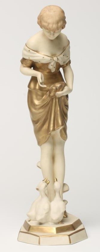 AN ART DECO ROYAL DUX BISQUE PORCELAIN FIGURE OF A YOUNG GIRL with shingled hair Image
