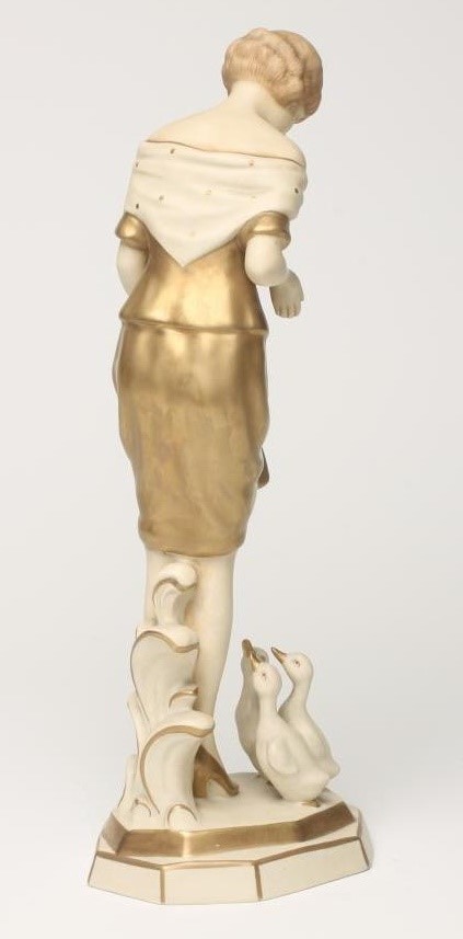AN ART DECO ROYAL DUX BISQUE PORCELAIN FIGURE OF A YOUNG GIRL with shingled hair Image