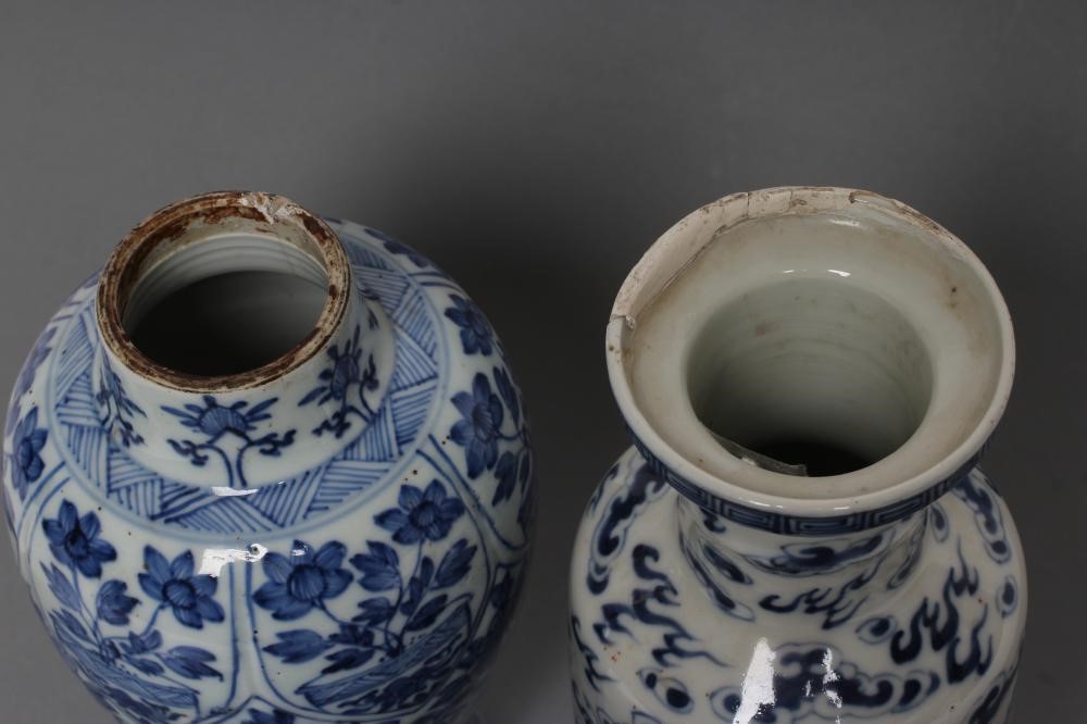 A CHINESE PORCELAIN ROULEAU VASE painted in underglaze blue with two dragons chasing the flaming Image