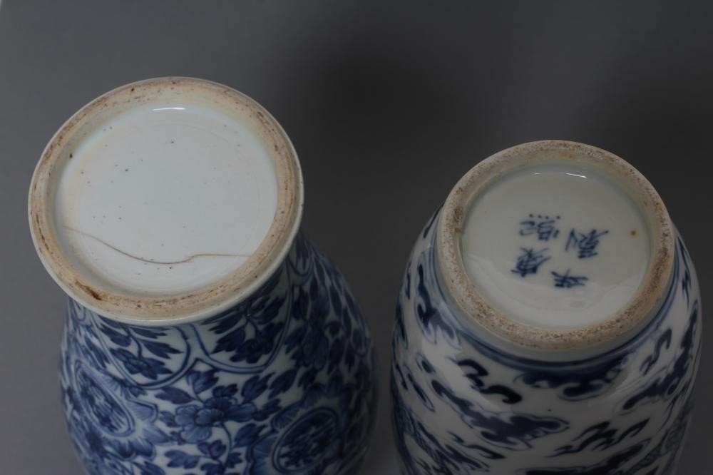 A CHINESE PORCELAIN ROULEAU VASE painted in underglaze blue with two dragons chasing the flaming Image