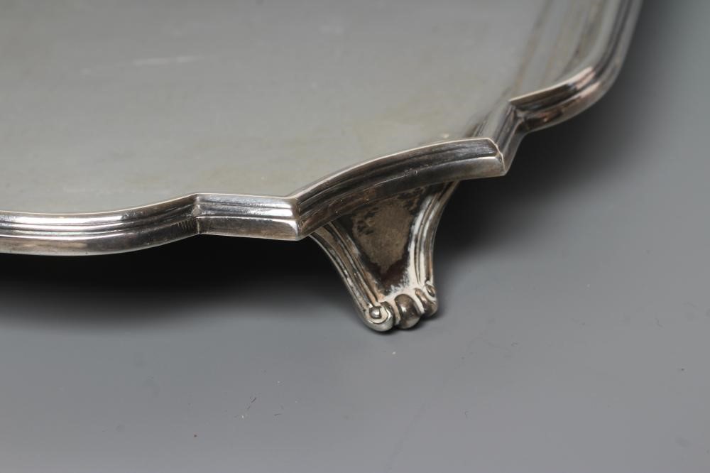 A SALVER, maker Wm. Haseler, Sheffield 1943, of canted square form with pie-crust rim, raised upon Image