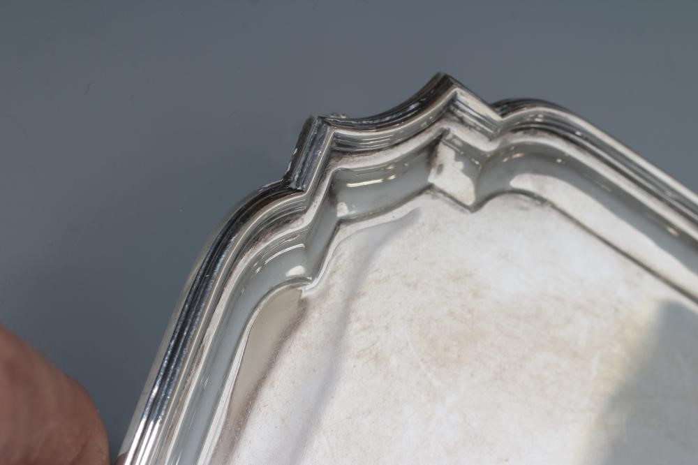 A SALVER, maker Wm. Haseler, Sheffield 1943, of canted square form with pie-crust rim, raised upon Image