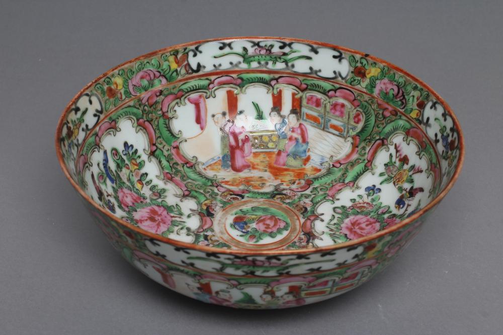 A CANTONESE PORCELAIN FAMILLE ROSE BOWL painted with panels of figures on verandahs and with finches Image