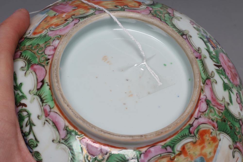 A CANTONESE PORCELAIN FAMILLE ROSE BOWL painted with panels of figures on verandahs and with finches Image