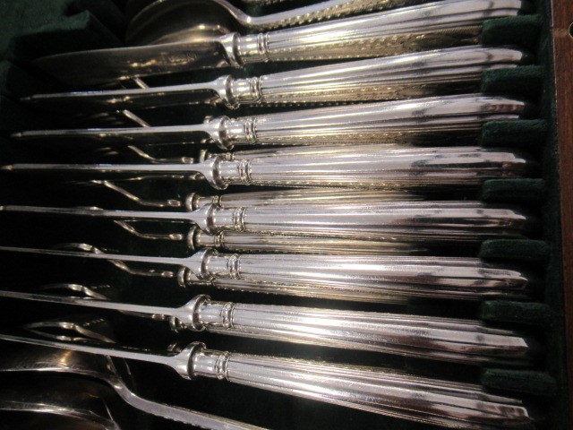 A TABLE SERVICE FOR EIGHT PLACE SETTINGS Image