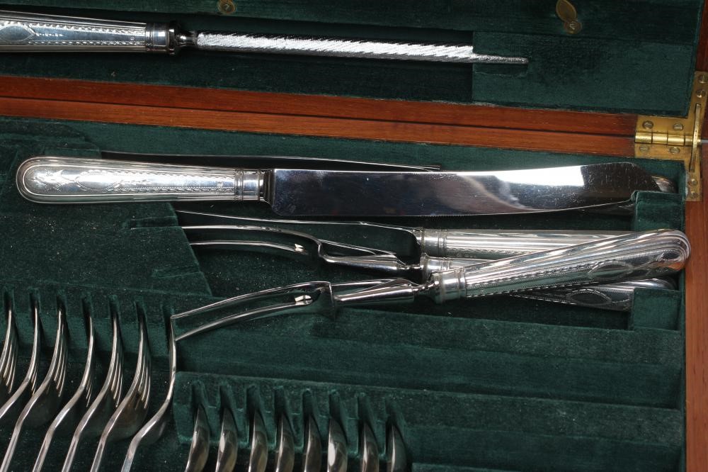 A TABLE SERVICE FOR EIGHT PLACE SETTINGS Image