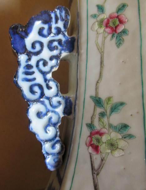 A CHINESE PORCELAIN VASE of swept octagonal form with two scrolling handles Image