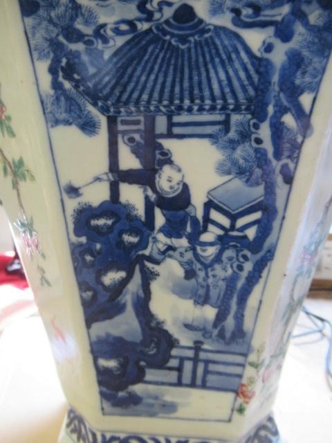 A CHINESE PORCELAIN VASE of swept octagonal form with two scrolling handles Image