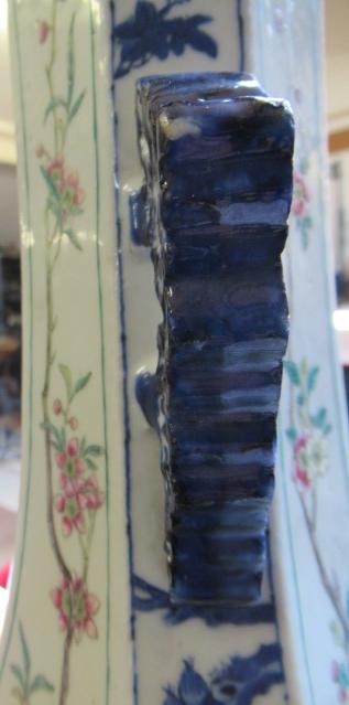 A CHINESE PORCELAIN VASE of swept octagonal form with two scrolling handles Image