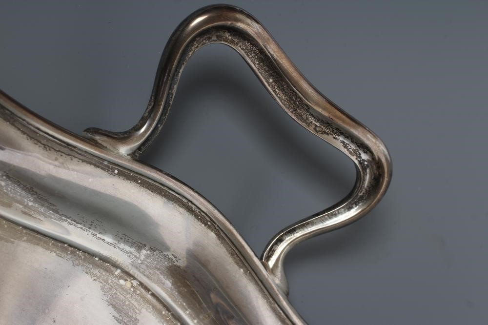A TWO HANDLED TEA TRAY, maker's mark HA, Sheffield 1920, of shaped oblong form with pie-crust rim, Image