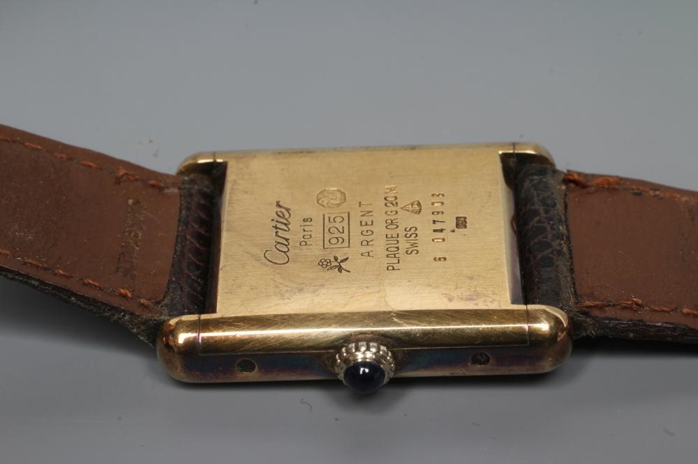 A MUST DE CARTIER SILVER GILT WRISTWATCH Image
