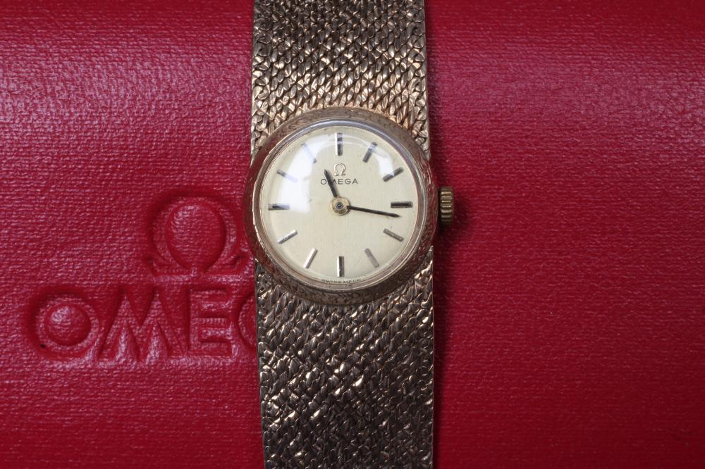 A LADY'S 9CT GOLD OMEGA WRISTWATCH Image