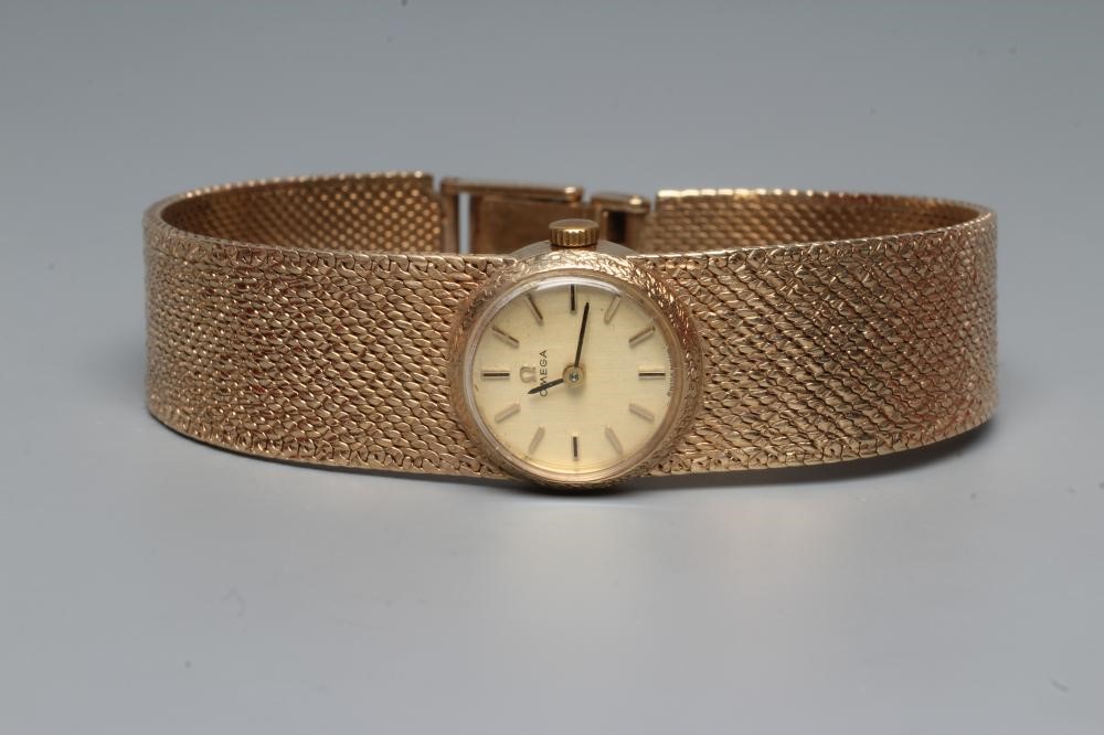 A LADY'S 9CT GOLD OMEGA WRISTWATCH Image
