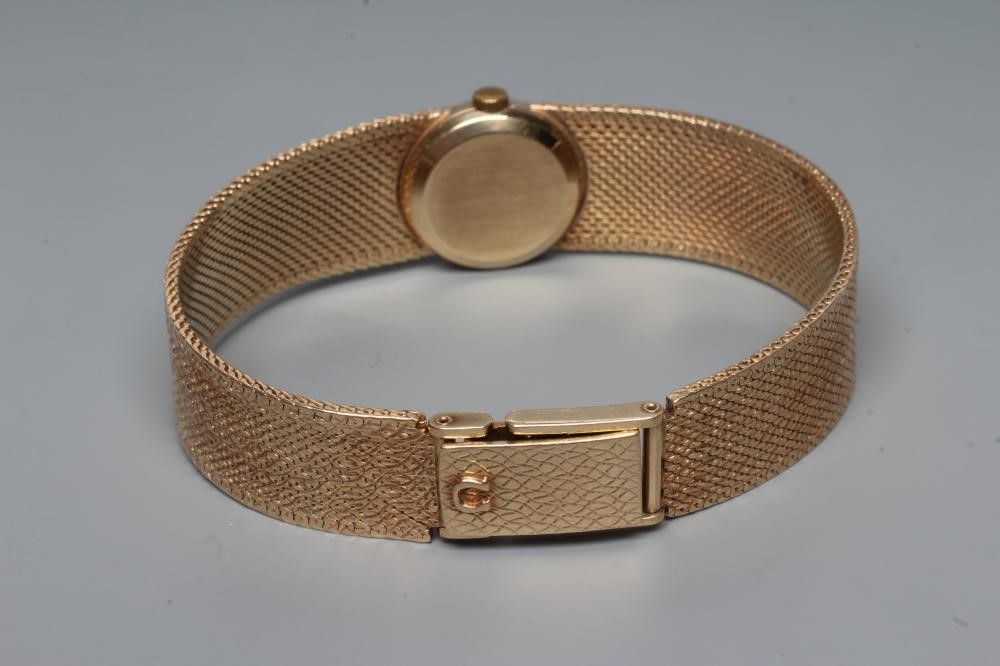 A LADY'S 9CT GOLD OMEGA WRISTWATCH Image
