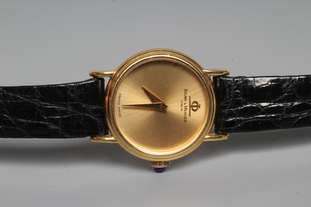 A LADY'S 18CT GOLD BAUME & MERCIER WRISTWATCH with plain dark champagne dial Image