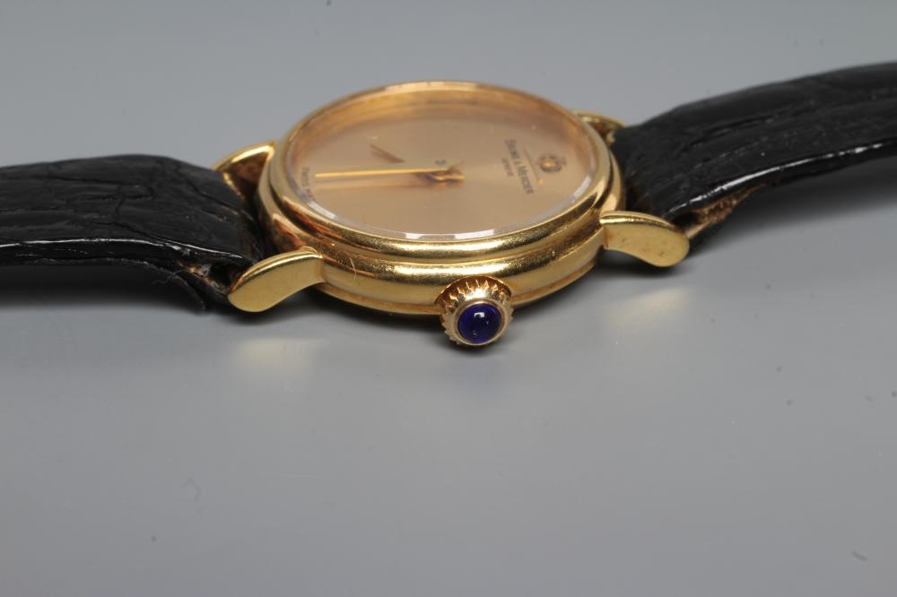 A LADY'S 18CT GOLD BAUME & MERCIER WRISTWATCH with plain dark champagne dial Image