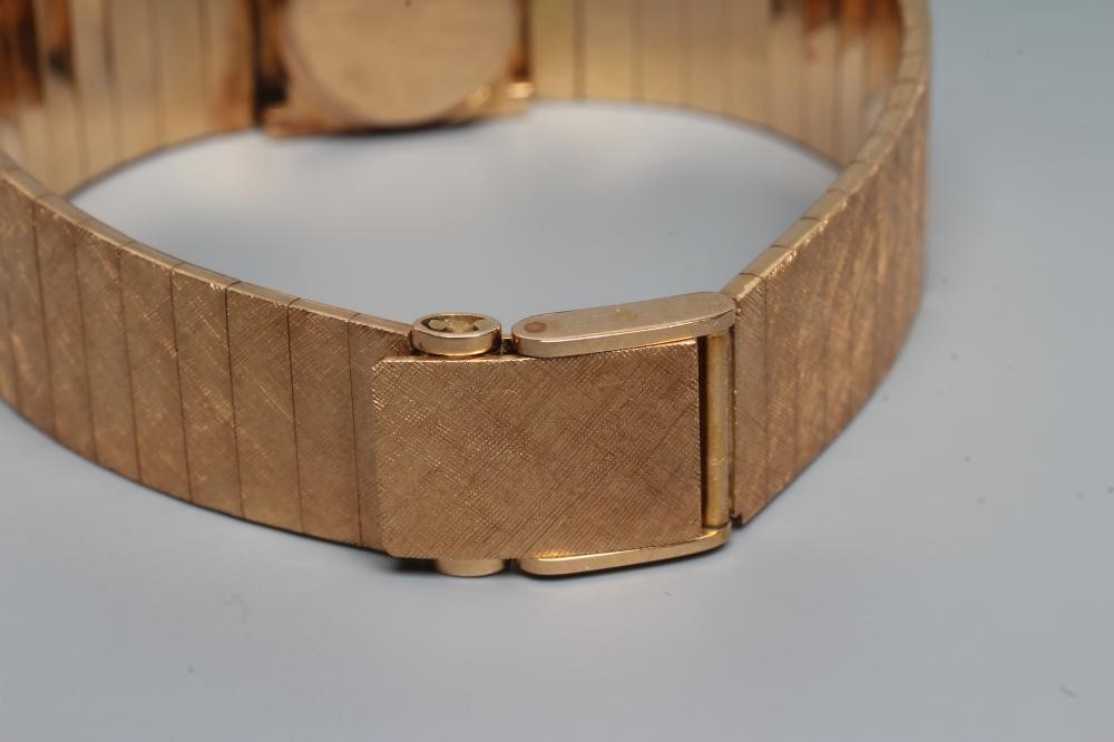 A LADY'S 18CT GOLD AND DIAMOND OMEGA WRISTWATCH Image