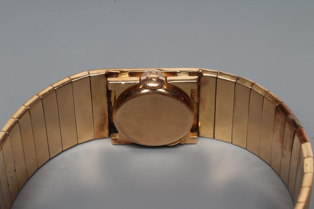 A LADY'S 18CT GOLD AND DIAMOND OMEGA WRISTWATCH Image
