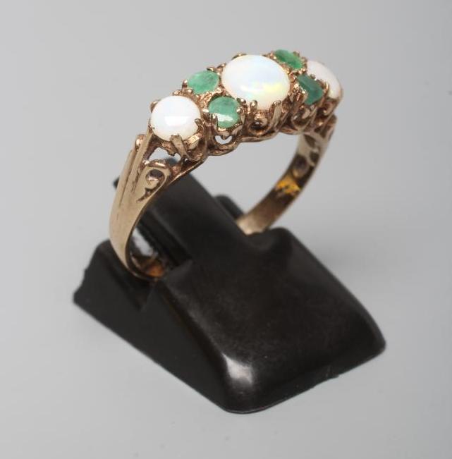 AN OPAL AND EMERALD RING Image
