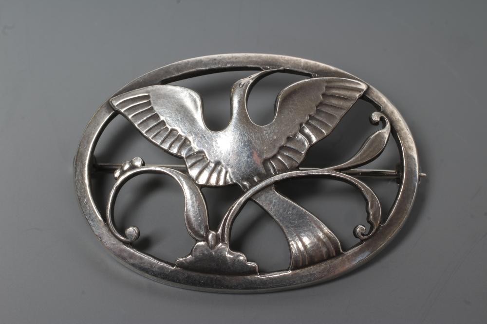 A GEORG JENSEN SILVER OVAL BROOCH designed by Arno Malinowski, cast as a crane in flight, stamped Image